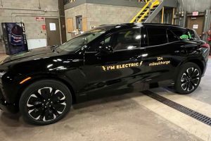 A black electric vehicle with the words "I'm Electric" on the side.